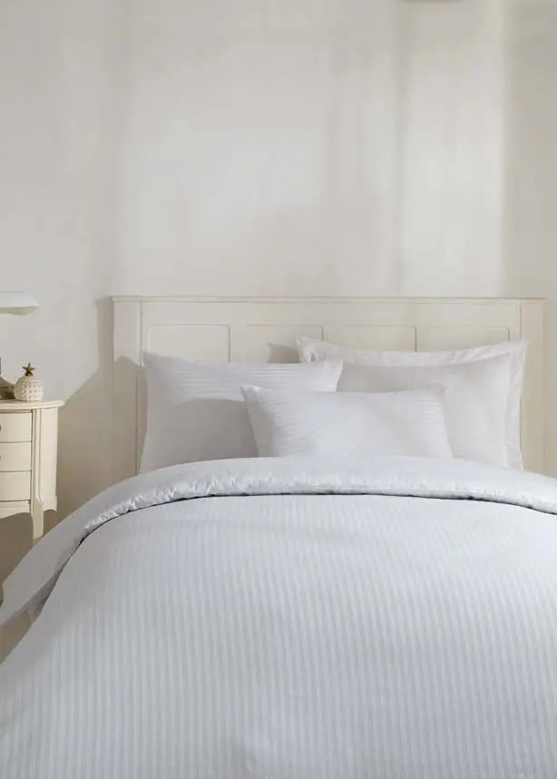 White pinstripe hotel bed linen