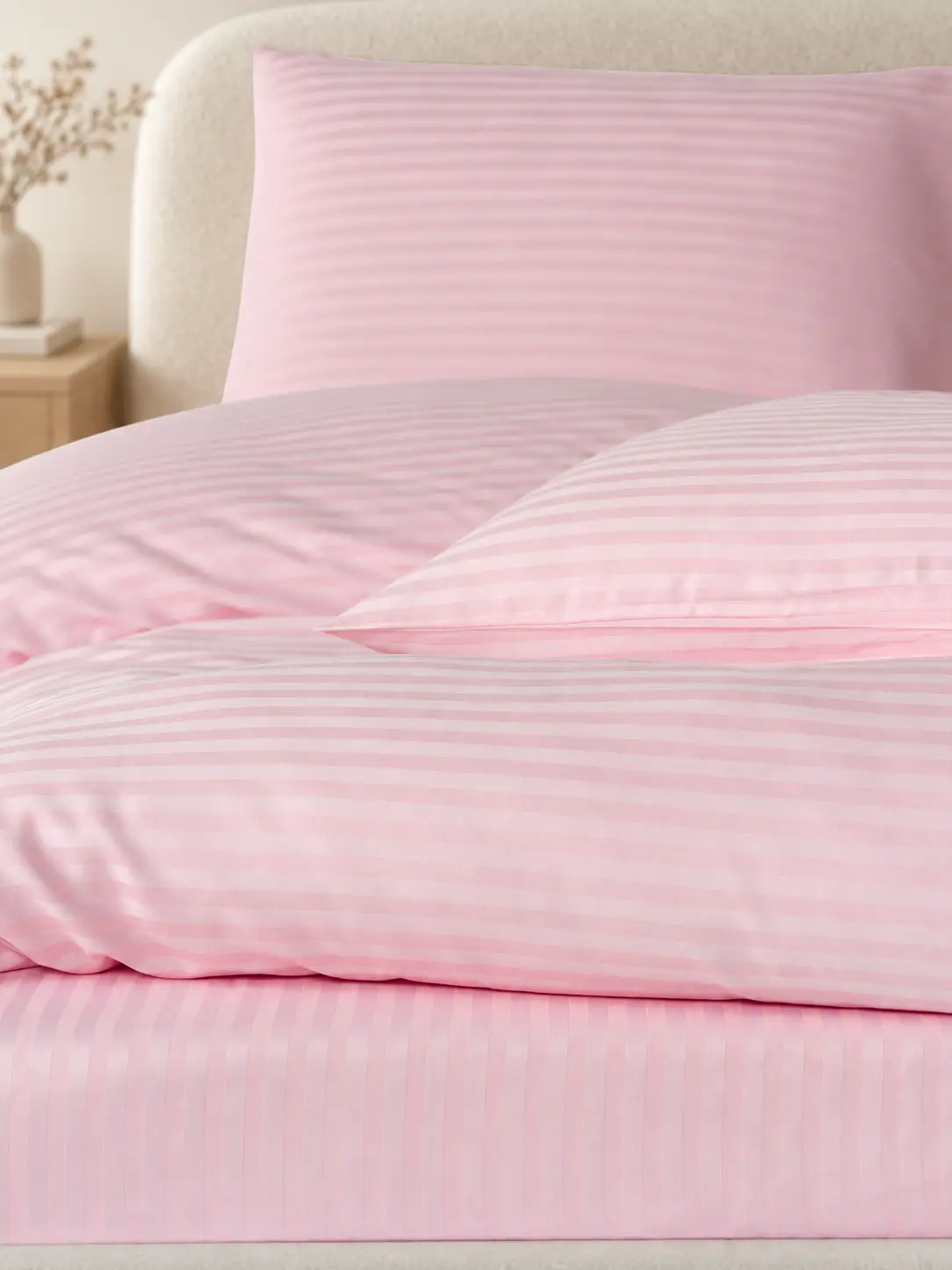 Blush satin stripe bedding detail