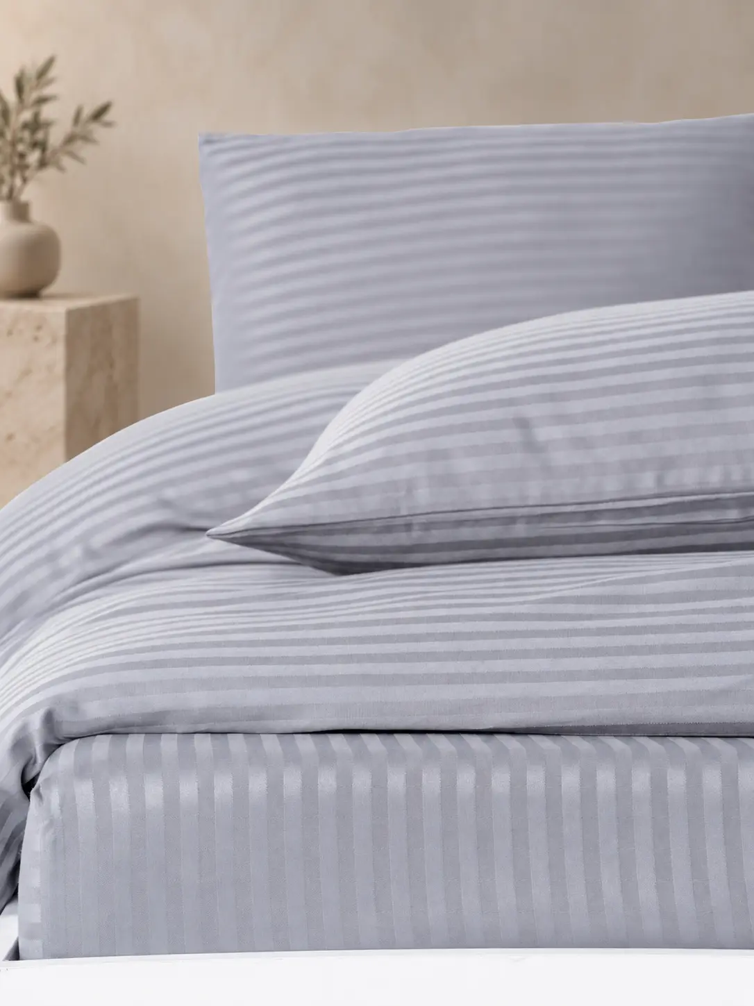 White satin stripe bedding detail